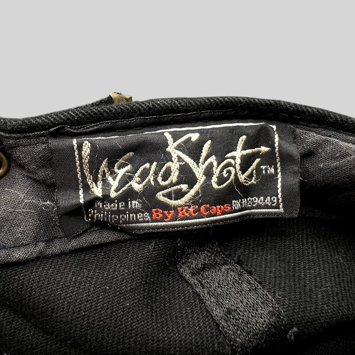 Raree Finds vintage 1990s KC Caps HeadShots label inside a black cotton hat