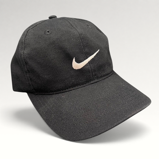 Raree Finds vintage 90s black Nike cotton snapback cap with an embroidered white Swoosh logo on the front panel