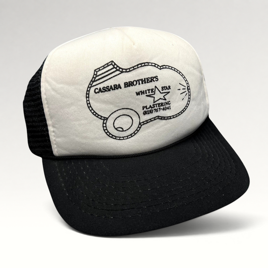 Raree Finds vintage Cassara Brothers White Star Plastering trucker hat with white foam front and black mesh back.