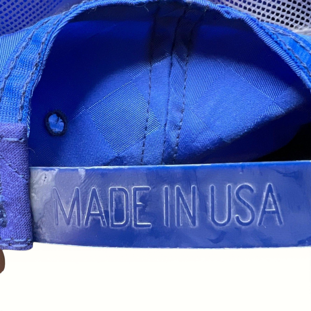 Raree Finds vintage royal blue snapback hat featuring a Made in USA embossed plastic strap detail