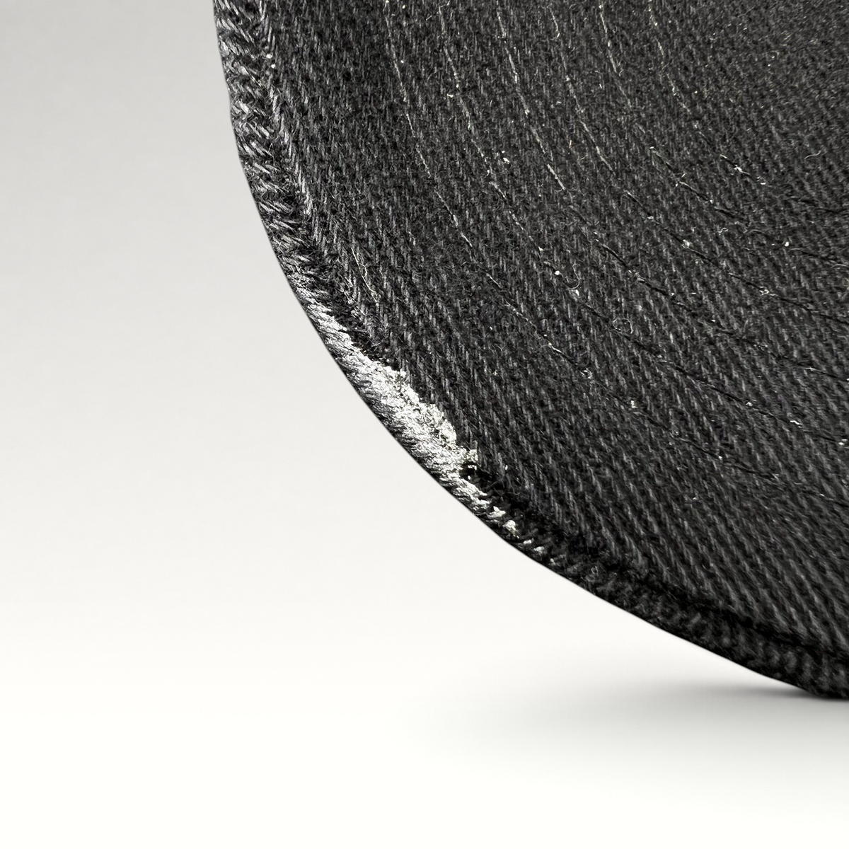 Raree Finds vintage 1990s black Timberline strapback hat brim detail showing worn fabric texture