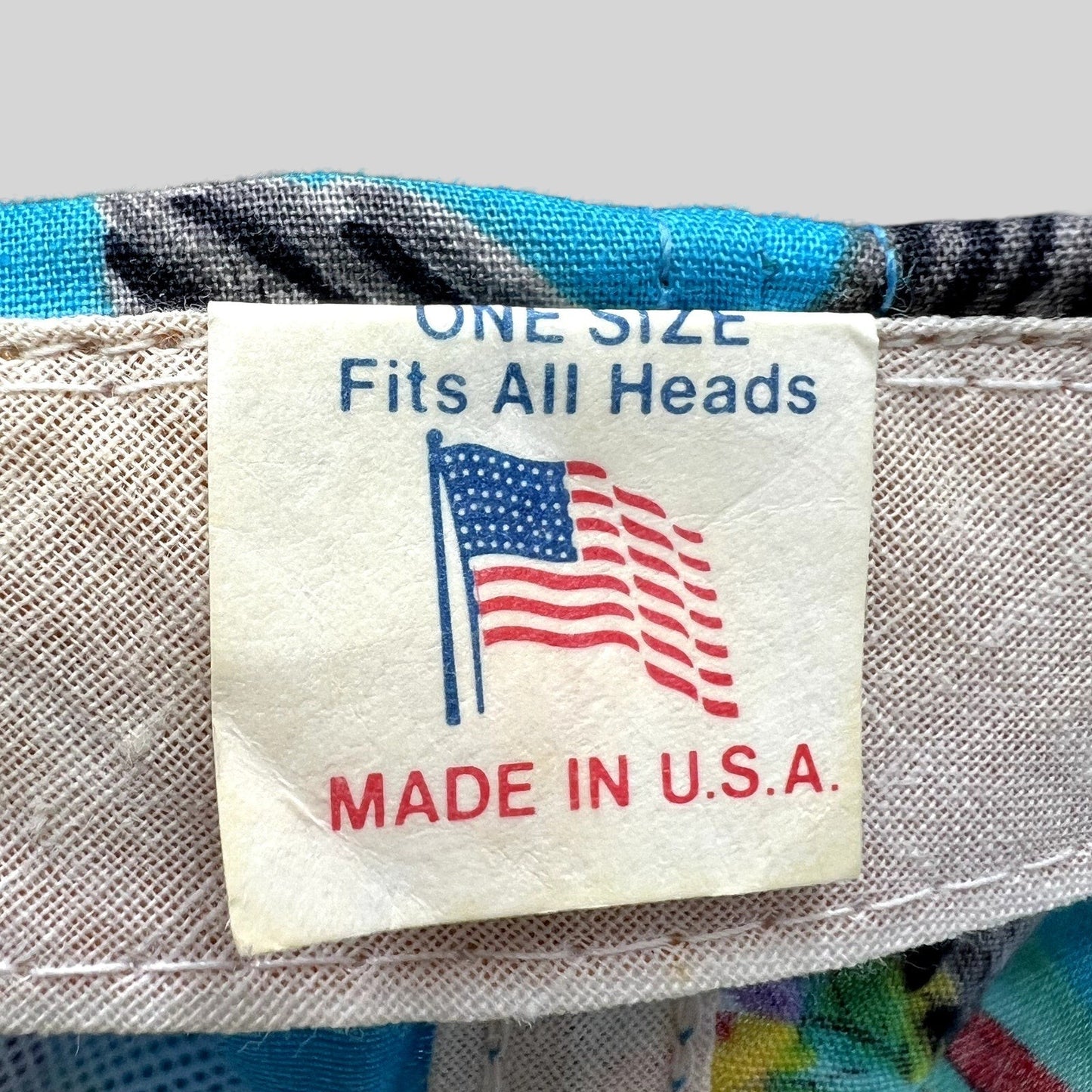 Raree Finds vintage 1992 golf hat interior tag showing Made in USA and One Size Fits All text with American flag icon
