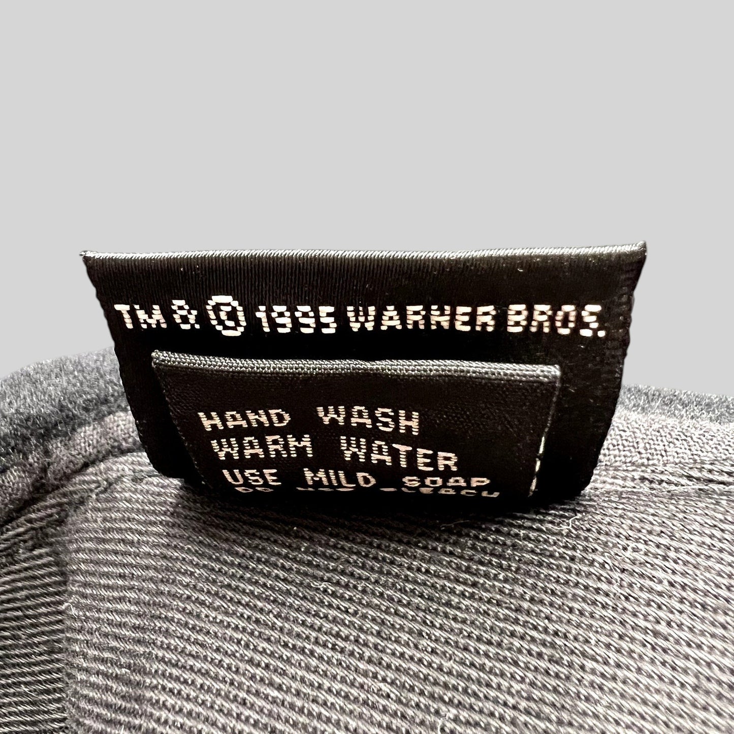Raree Finds vintage 1995 Warner Bros wool hat interior care tag with washing instructions