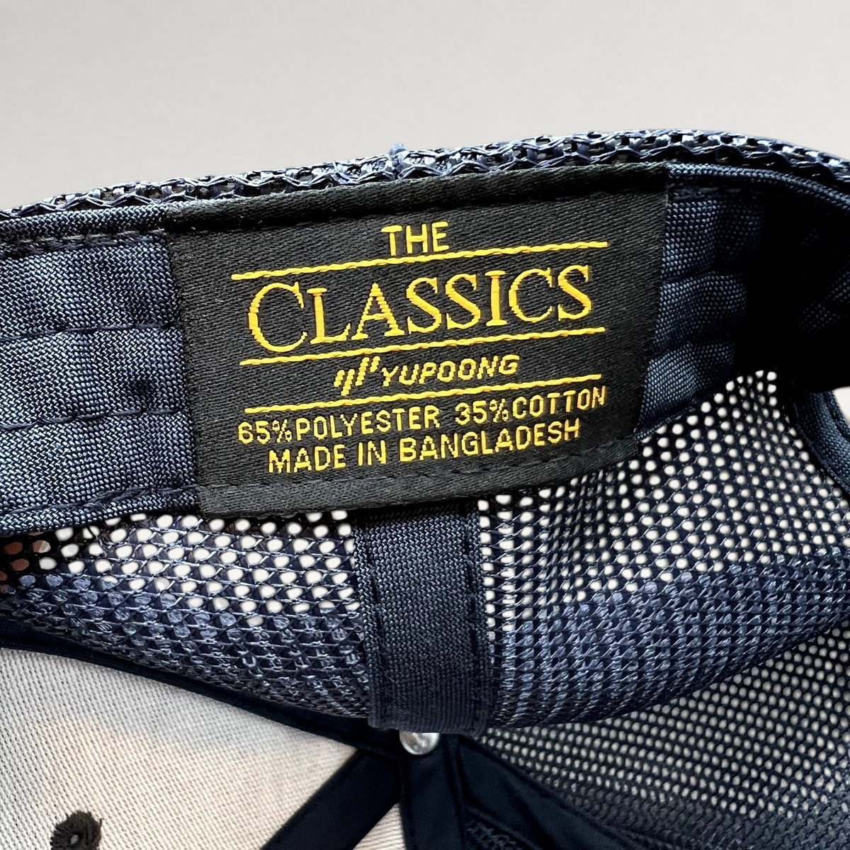 Raree Finds Diller Teen Fellows Yupoong Classics trucker hat interior label showing material and origin details