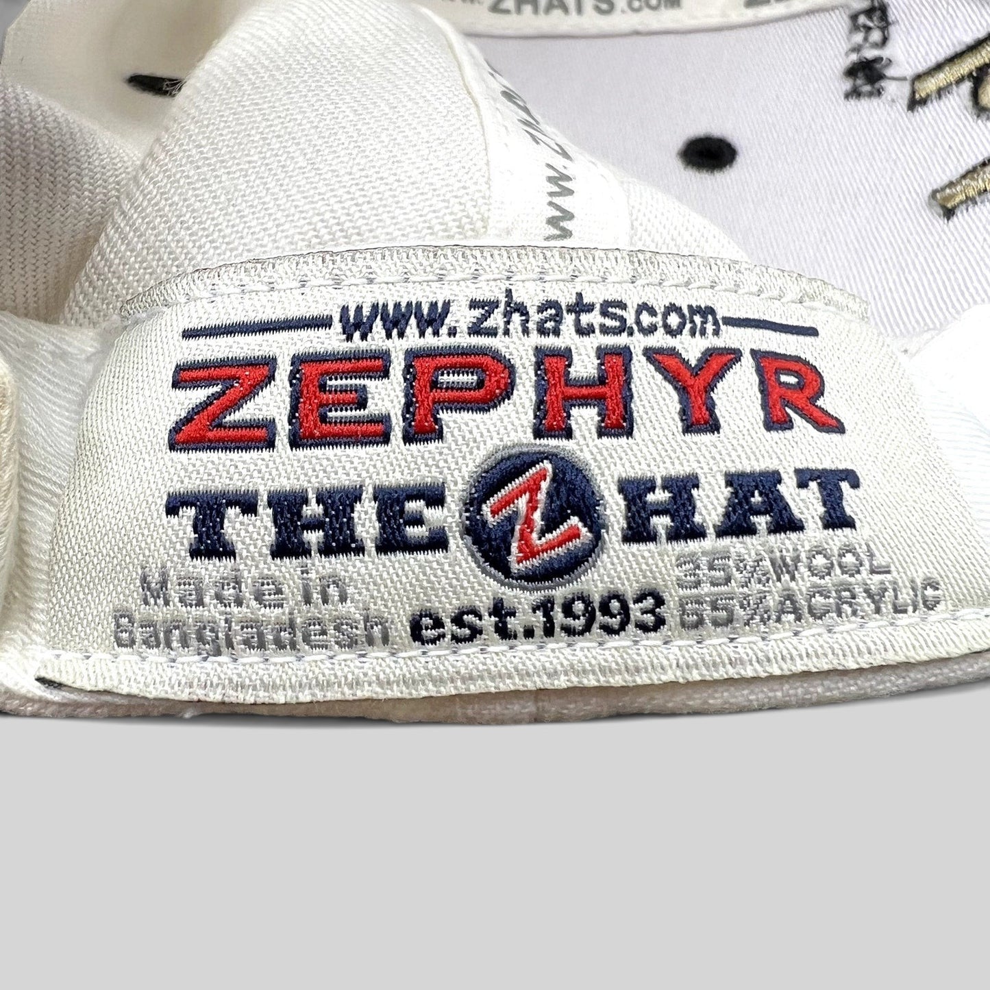 Raree Finds Zephyr hat interior label showing branding, material composition, and origin details