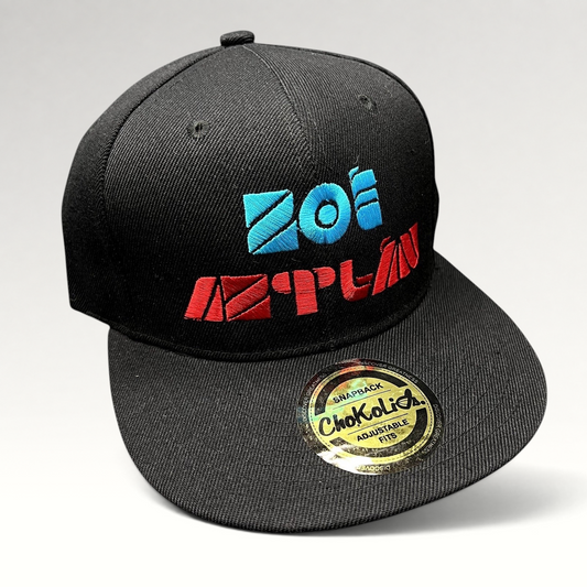 Raree Finds black Chokolids snapback hat featuring embroidered turquoise and red Zoé Aztlán album logo on flat bill