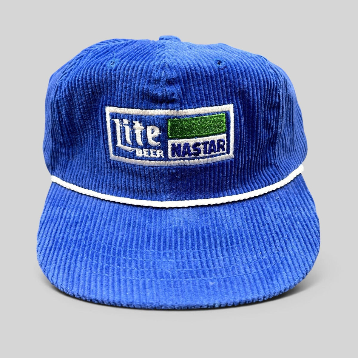 Raree Finds vintage royal blue corduroy strapback hat with Lite Beer and NASTAR embroidered patch and white rope trim.