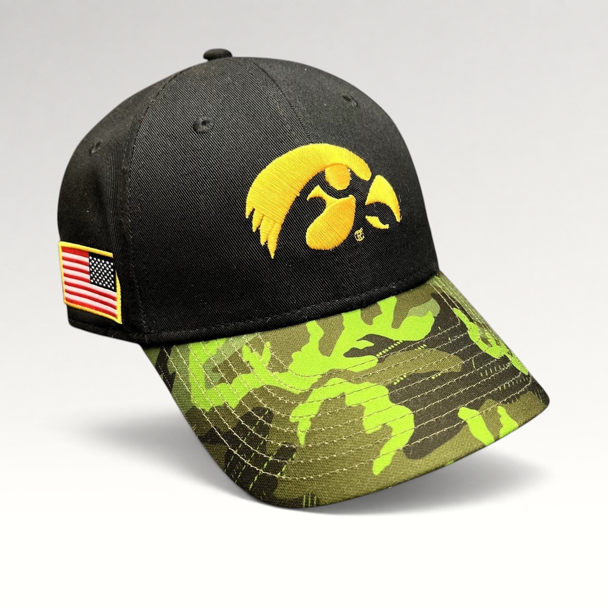 Raree Finds Nike Iowa Hawkeyes strapback hat with black crown, green camo visor, and embroidered gold Hawkeye logo.