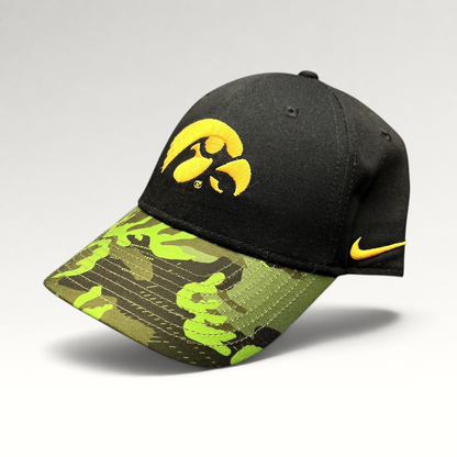 Raree Finds Nike Iowa Hawkeyes Legacy91 strapback hat with a black crown, gold logo, and green camouflage visor.