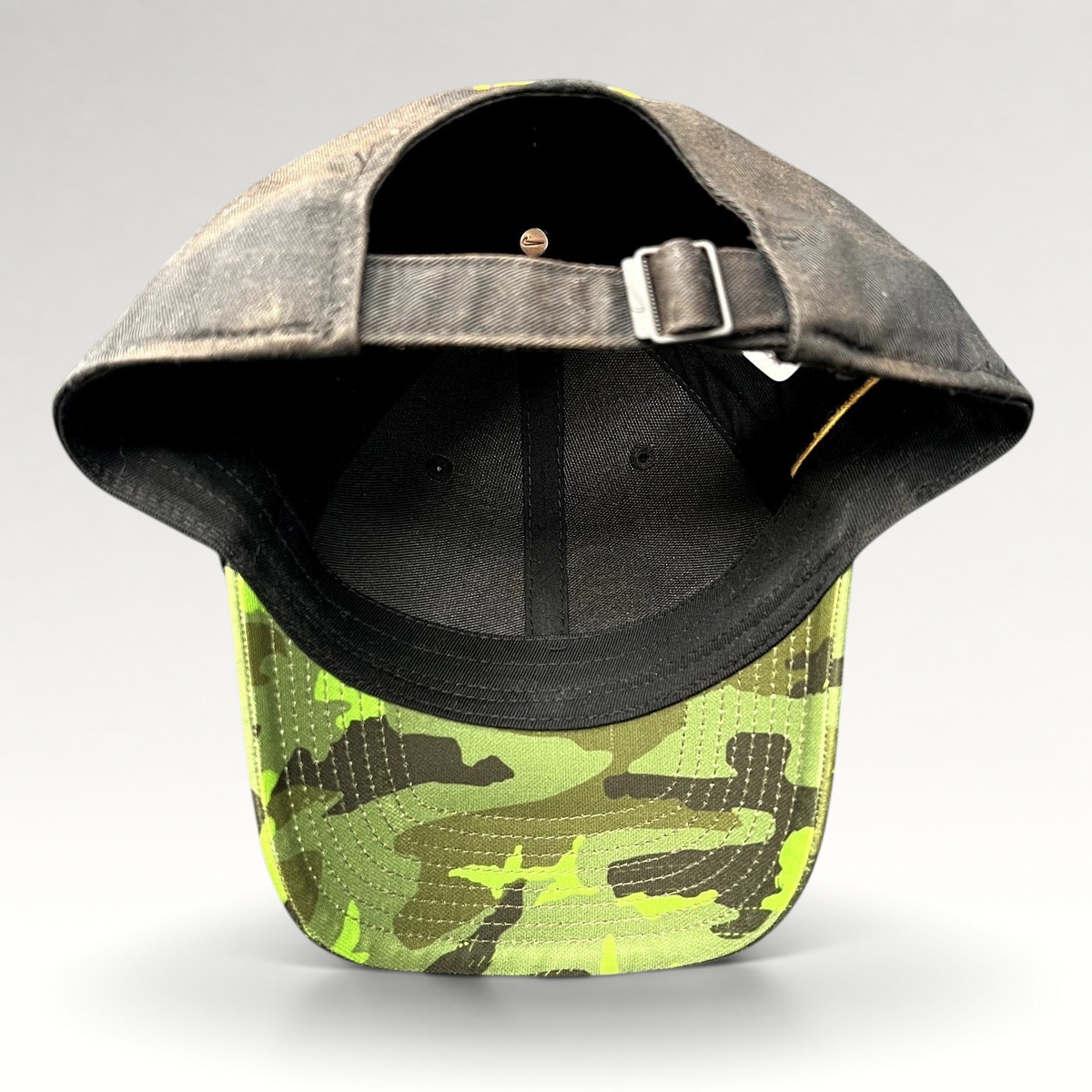 Raree Finds Nike Iowa Hawkeyes Legacy91 strapback hat showing the black crown, green camo visor, and adjustable strap.