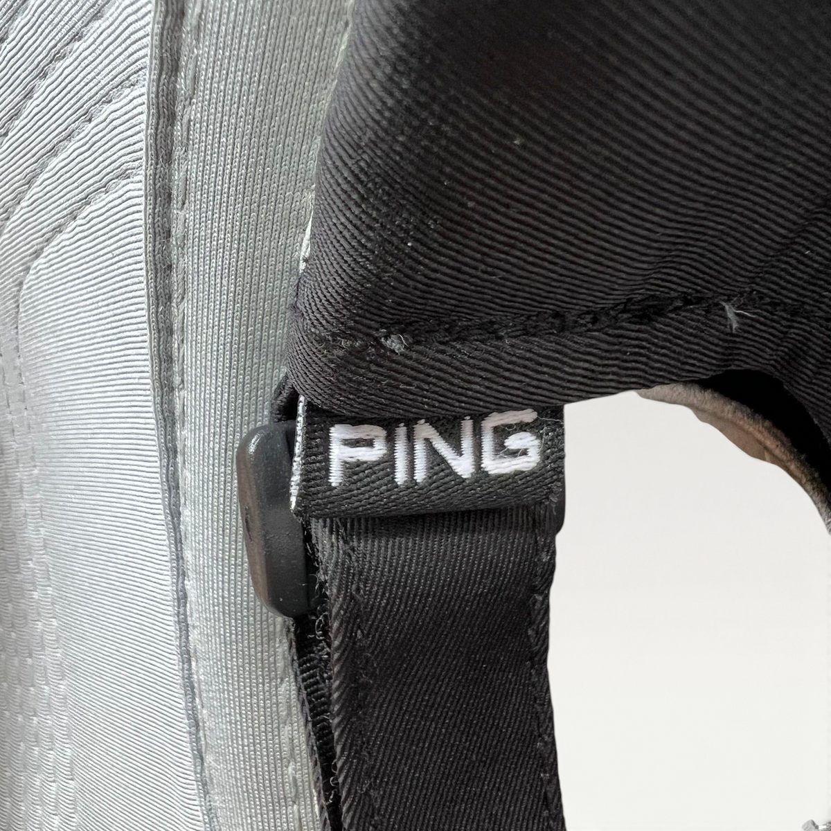 Raree Finds PING golf hat featuring a black strapback closure with a white embroidered PING logo tag