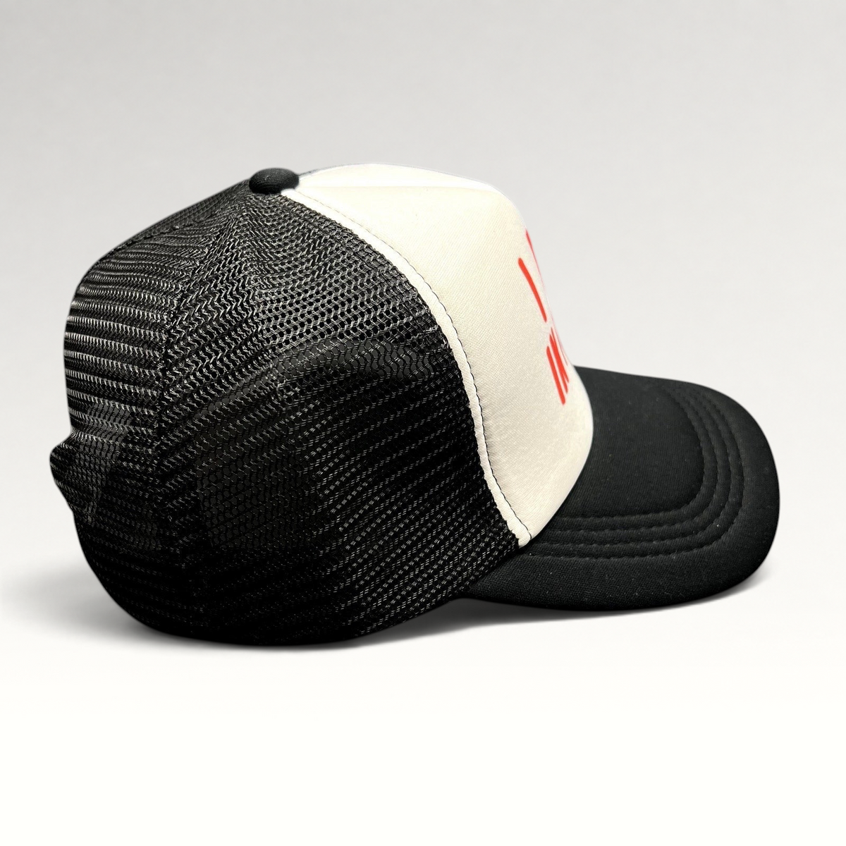 Raree Finds novelty trucker hat with white foam front, black mesh back, and red I Pee In Pools text on a black brim.