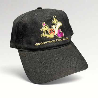 Raree Finds black cotton strapback hat featuring colorful embroidered Woodstock Collection Love logo and peace sign.