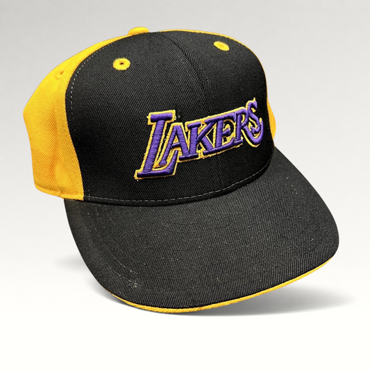 Raree Finds vintage Reebok Los Angeles Lakers fitted hat featuring a black crown, gold panels, and purple embroidery.