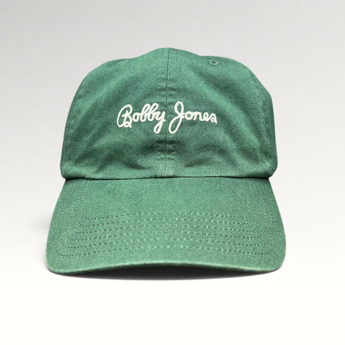 Green Bobby Jones strapback hat, front view