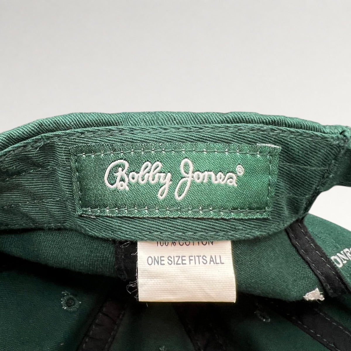 Bobby Jones interior label showing 100% cotton and one size fits all