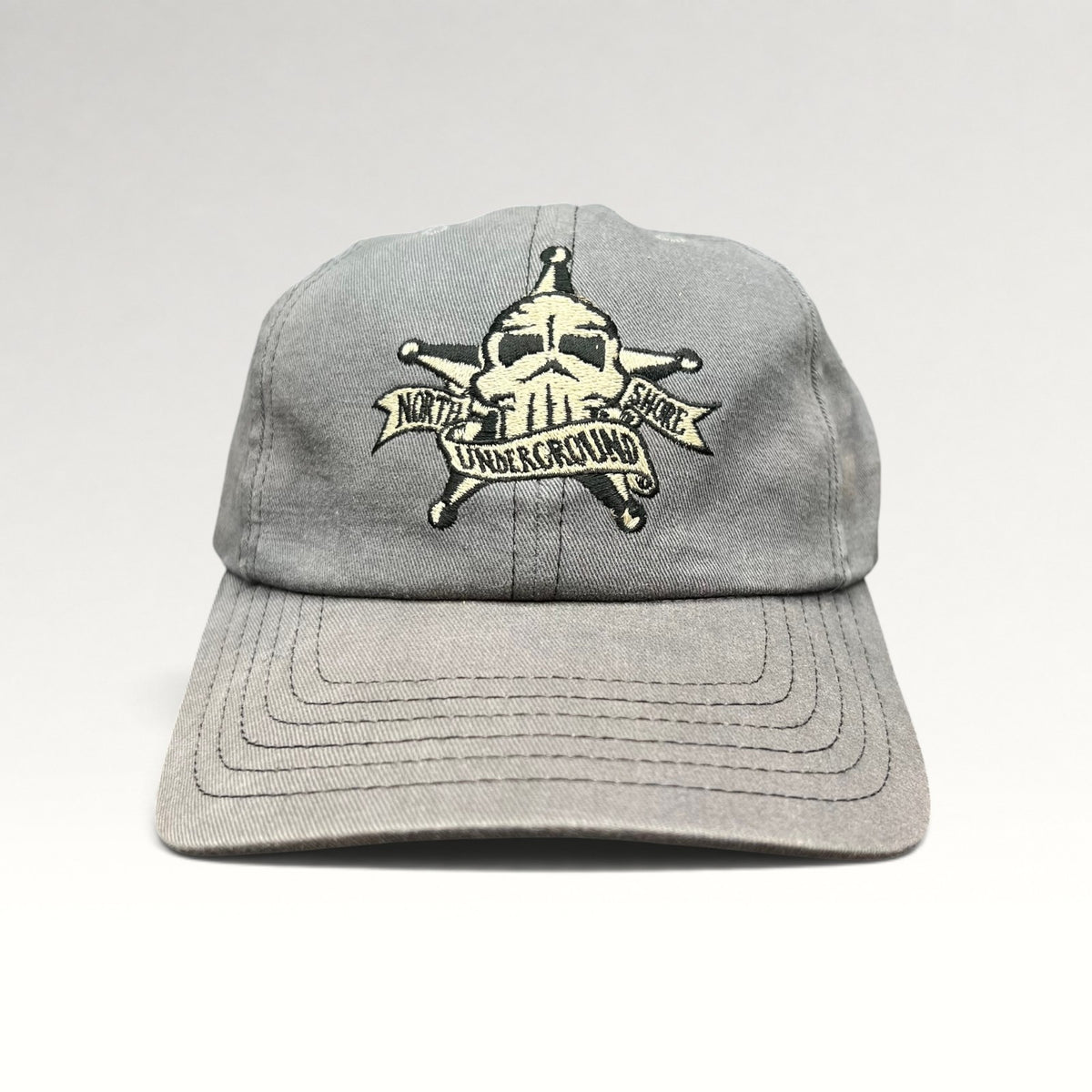 Front view of gray North Shore Underground 1990s snapback hat