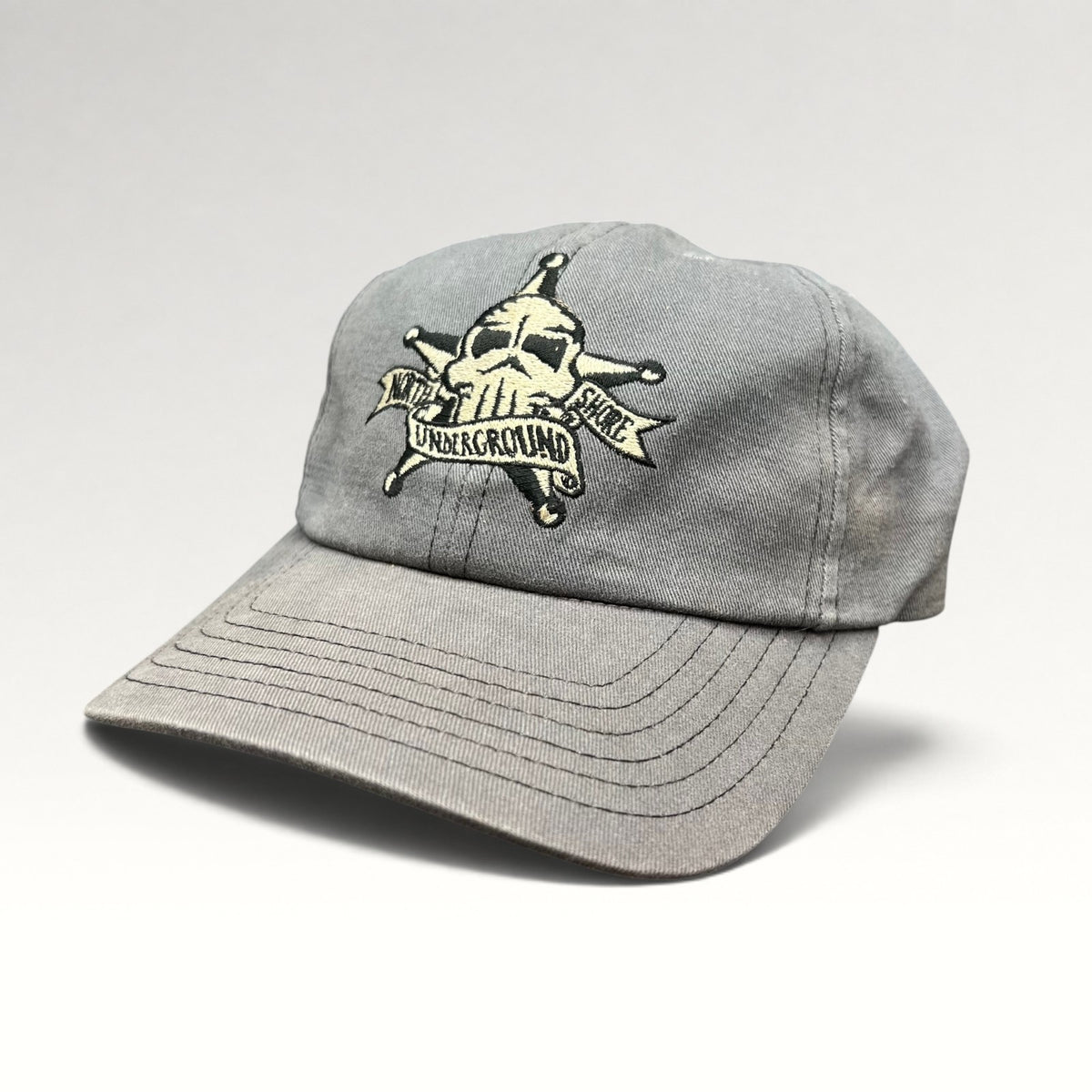 Opposite three-quarter view of gray North Shore Underground snapback hat