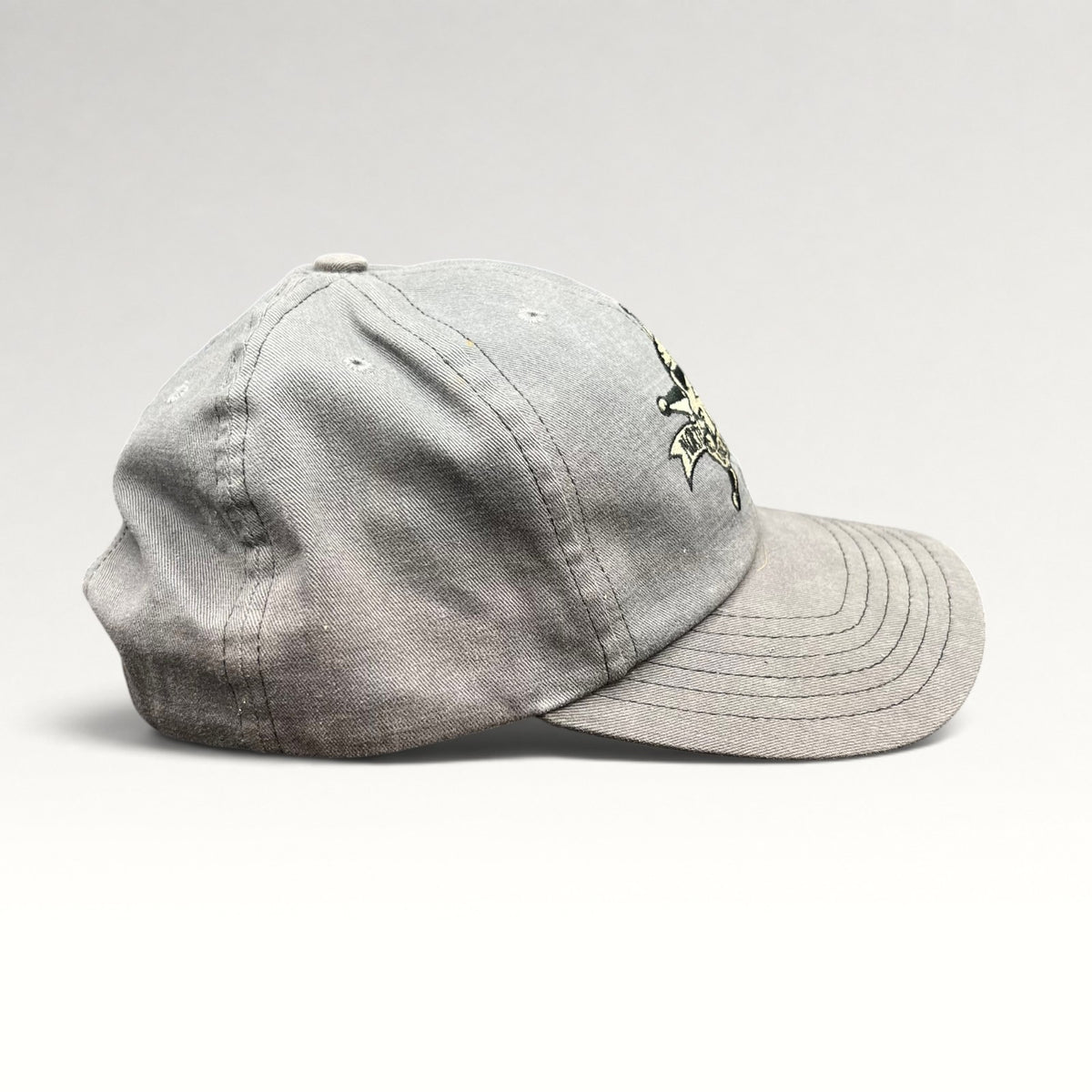 Right side view of gray North Shore Underground snapback hat