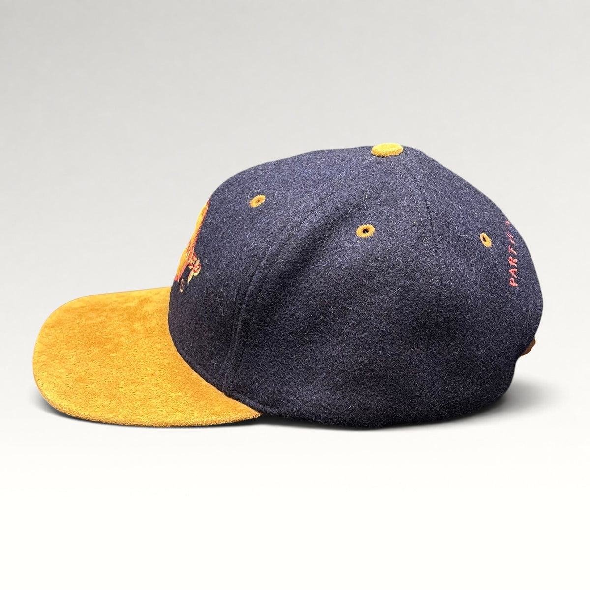 Vintage 1990s Walt Disney Studios navy and tan strapback hat, left side