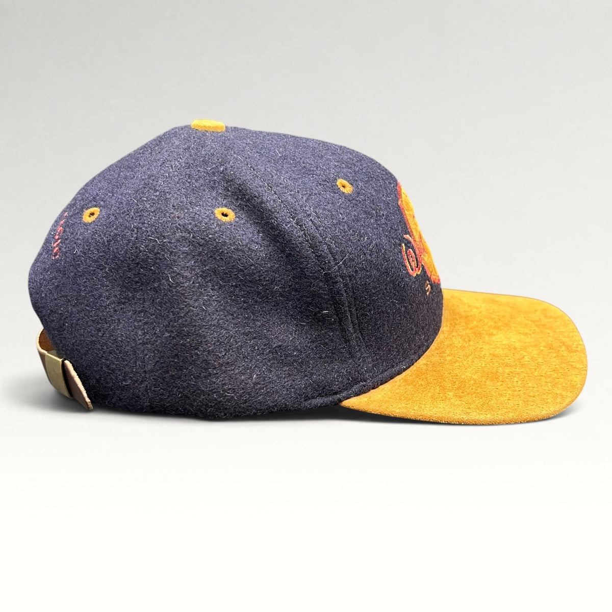 Vintage 1990s Walt Disney Studios navy and tan strapback hat, right side