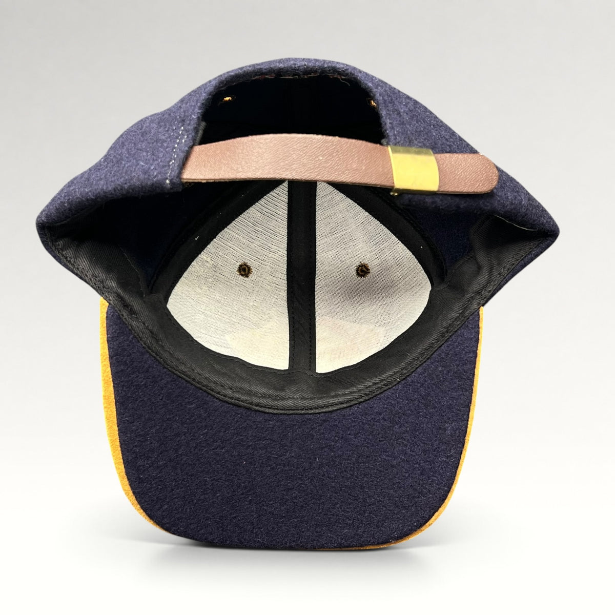 Vintage 1990s Walt Disney Studios navy and tan strapback hat, interior and strap