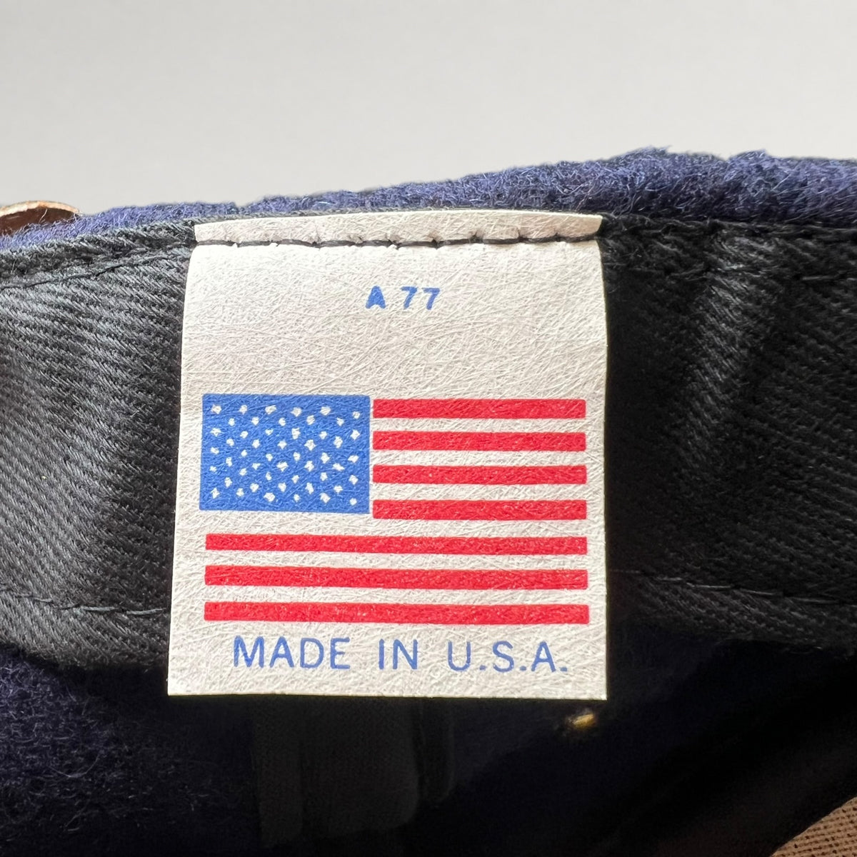Vintage 1990s Walt Disney Studios navy and tan strapback hat, Made in USA label