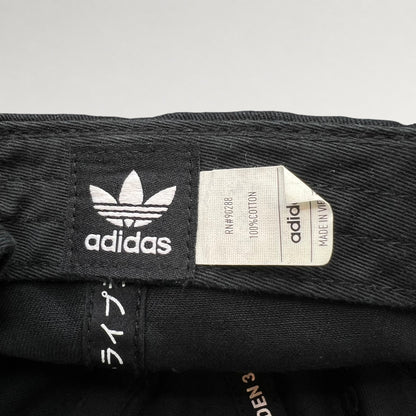 Adidas Trefoil label and 100% cotton tag