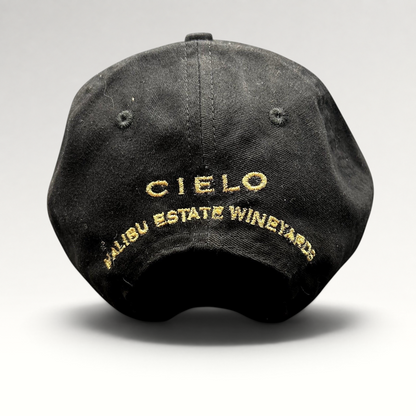 Raree Finds black cotton strapback hat featuring gold embroidered Cielo Malibu Estate Vineyards text on the back