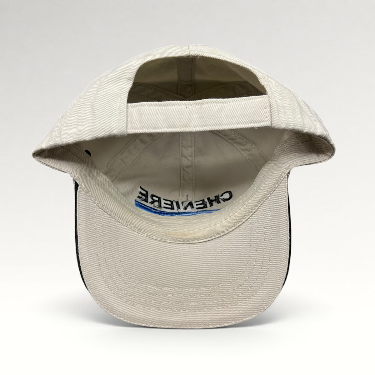 Interior, underside of brim, and adjustable strap