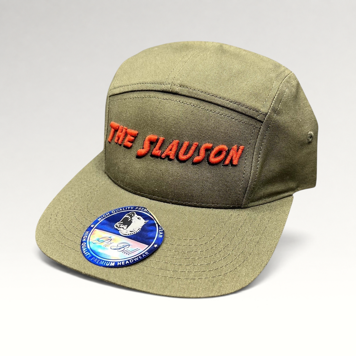Raree Finds olive green 5-panel strapback hat with The Slauson embroidered in red on the front and a Pit Bull sticker.