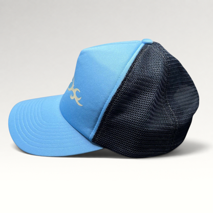 Raree Finds vintage light blue Nike trucker hat with navy mesh back and tribal swoosh graphic, side profile view.