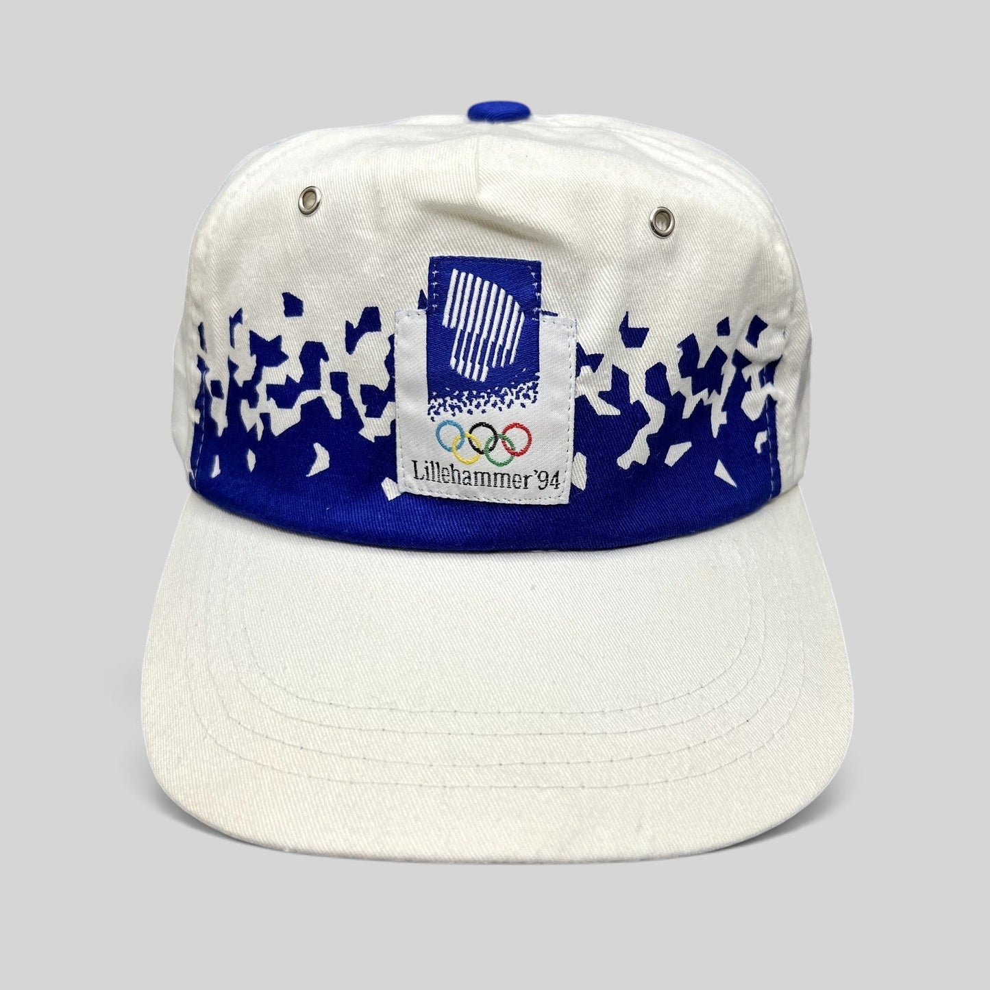 Raree Finds vintage 1994 Lillehammer Winter Olympics flex-back hat with blue and white Nordic graphic and logo patch