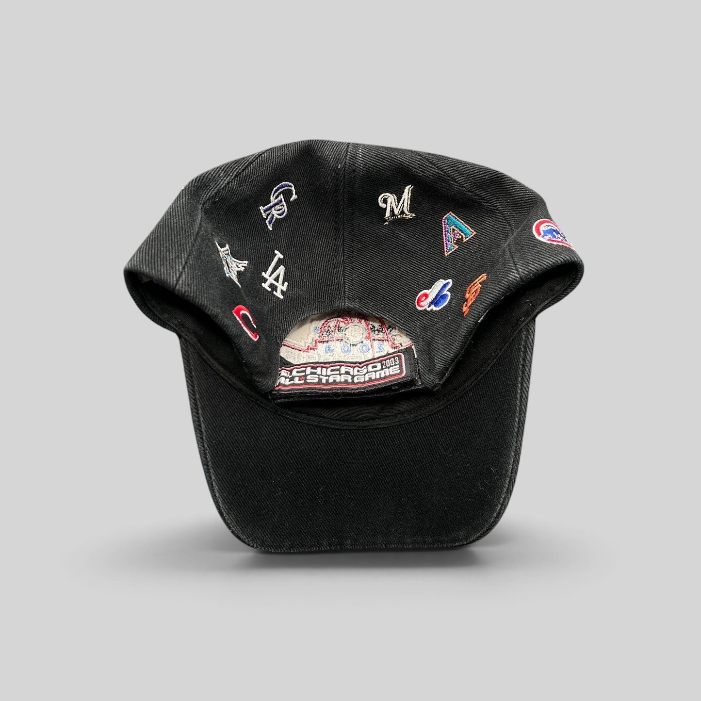 Raree Finds black cotton twill 2003 MLB All-Star Game hat featuring embroidered multi-team logos and adjustable strap.
