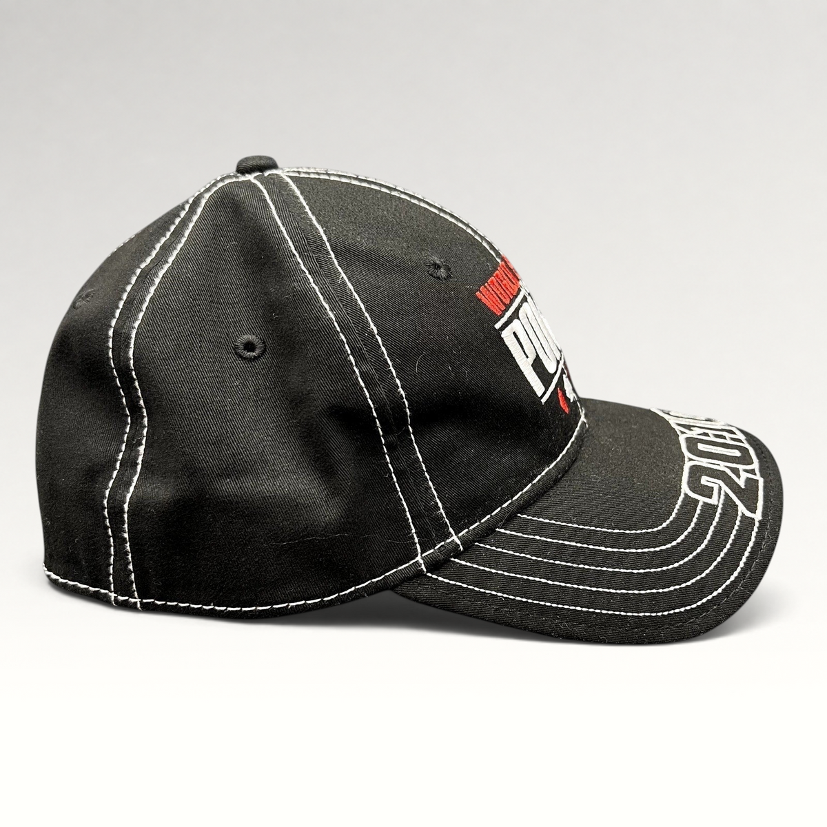 Raree Finds 2010 World Series of Poker black flexfit hat with white contrast stitching and embroidered brim detail.
