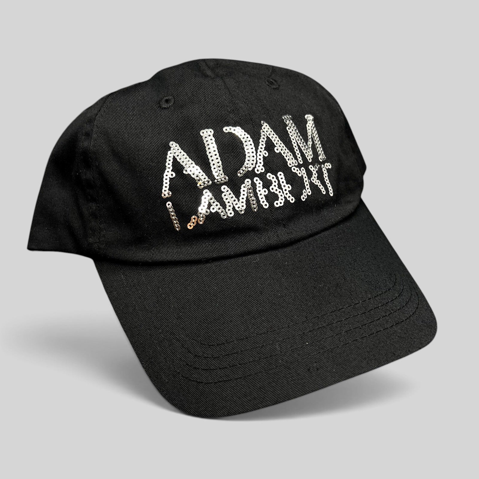 Raree Finds black cotton snapback hat featuring a silver sequin Adam Lambert logo on the front