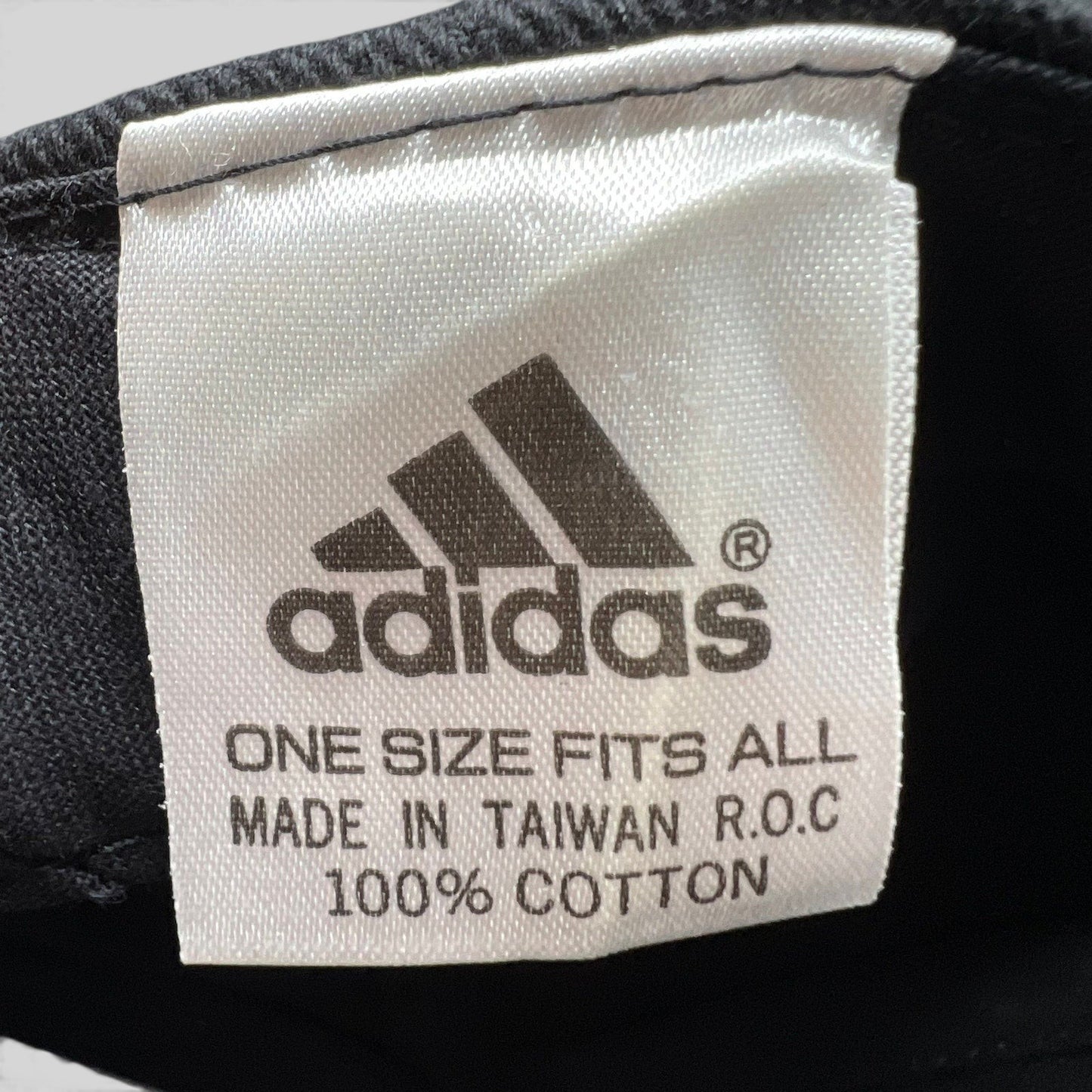 Raree Finds vintage Adidas hat interior tag showing 100 percent cotton material and Made in Taiwan origin