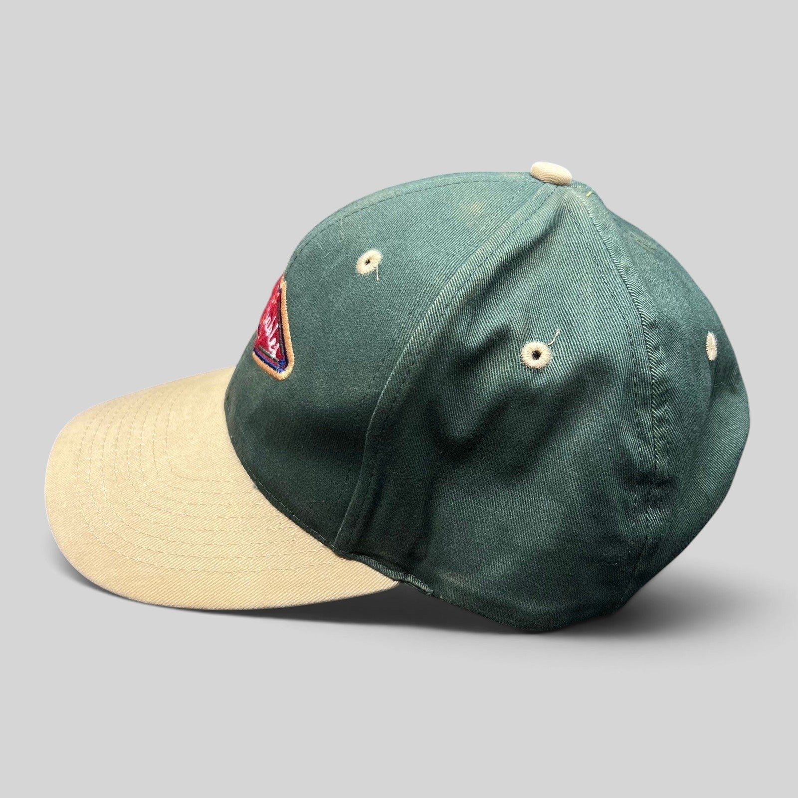 Raree Finds vintage Ahead Headgear two-tone golf cap in forest green and khaki with Green Gables Pub patch