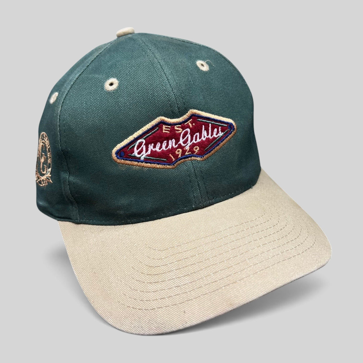 Raree Finds vintage Ahead Headgear strapback hat with forest green crown, khaki brim, and Green Gables 1929 patch.