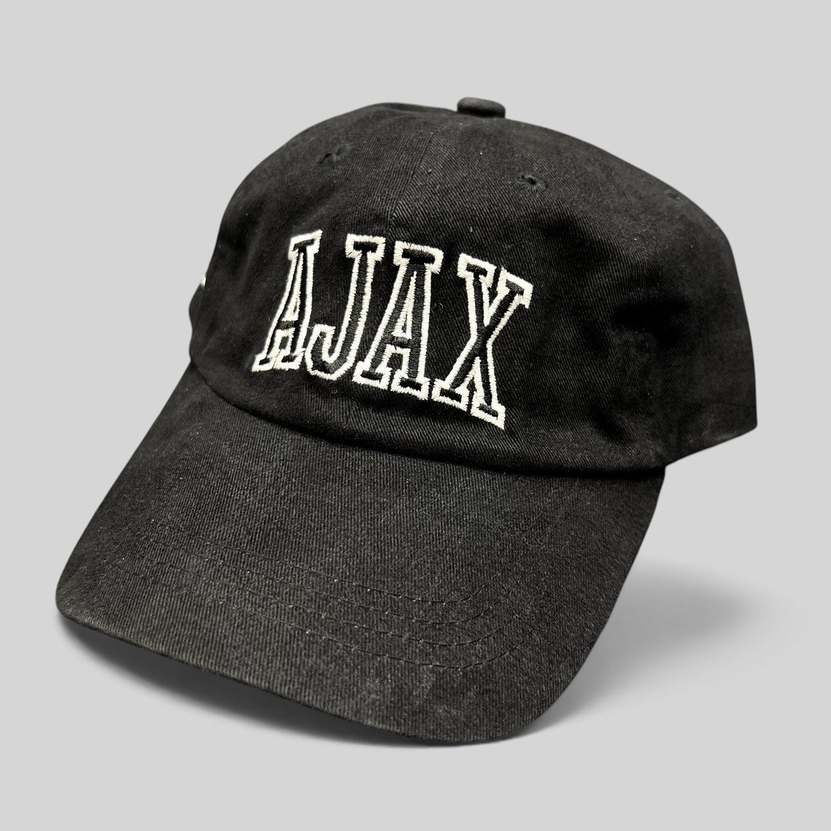 Raree Finds black cotton Aspen Snowmass AJAX strapback hat with white embroidered lettering on the front