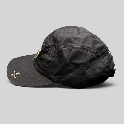 Raree Finds Akomplice Clothing black cotton strapback hat with a colorful embroidered crest patch and brim detail.