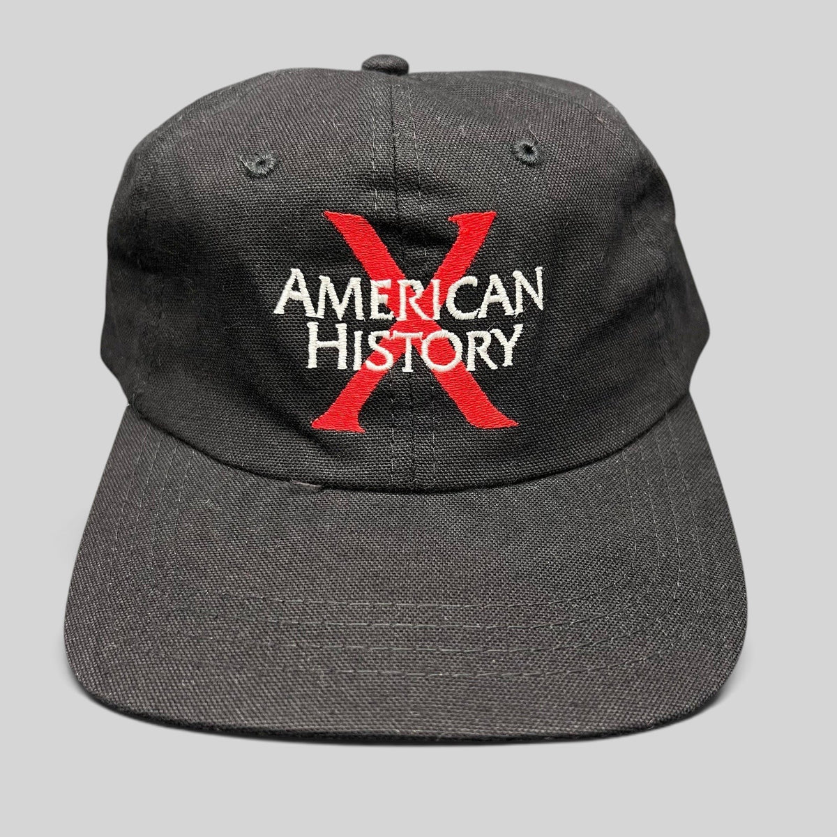 Raree Finds vintage 1998 American History X promotional black cotton snapback hat with red X and white embroidery.