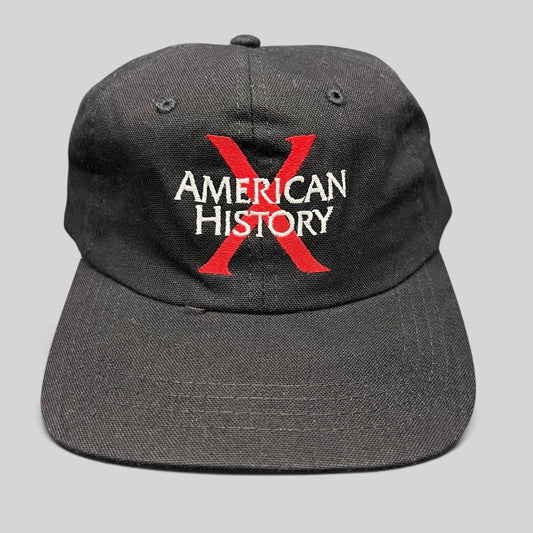 Raree Finds vintage 1998 American History X promotional black cotton snapback hat with red X and white embroidery.