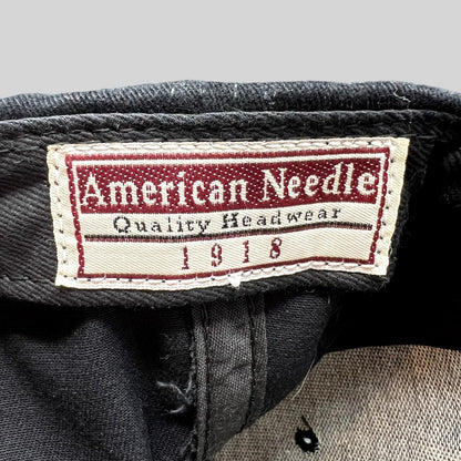 Raree Finds vintage American Needle hat interior tag with red and white branding on black cotton twill fabric