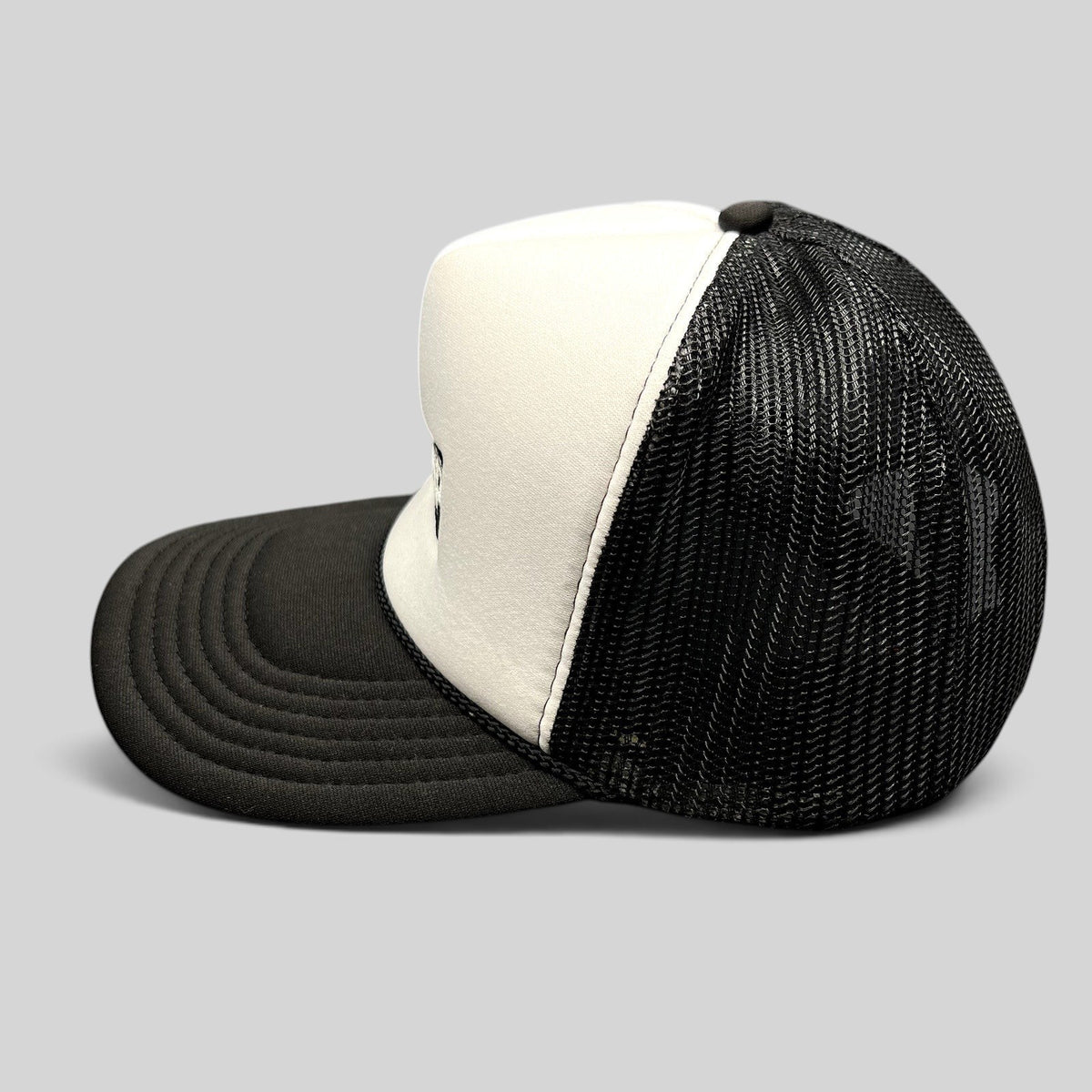 Raree Finds vintage AMP Any Means Possible trucker hat with white foam front, black mesh back, and curved brim.