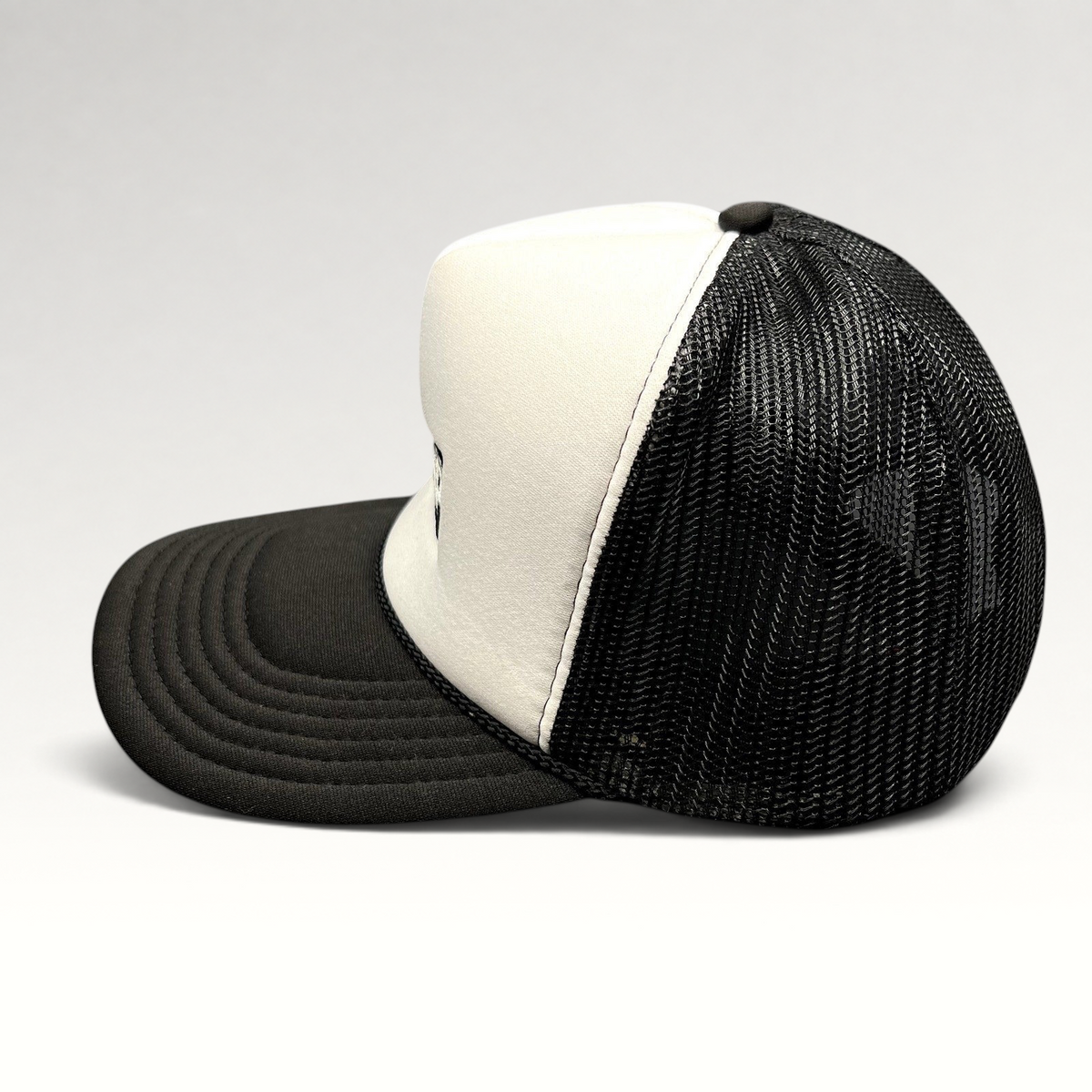 Raree Finds vintage AMP Any Means Possible trucker hat with white foam front, black mesh back, and curved brim.