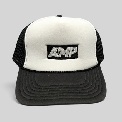 Raree Finds vintage AMP trucker hat with white foam front, black mesh back, and embroidered logo on a curved brim.