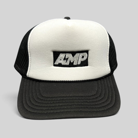 Raree Finds vintage AMP trucker hat with white foam front, black mesh back, and embroidered logo on a curved brim.