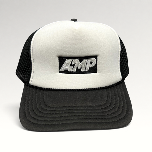 Raree Finds vintage AMP trucker hat with white foam front, black mesh back, and embroidered logo on a curved brim.