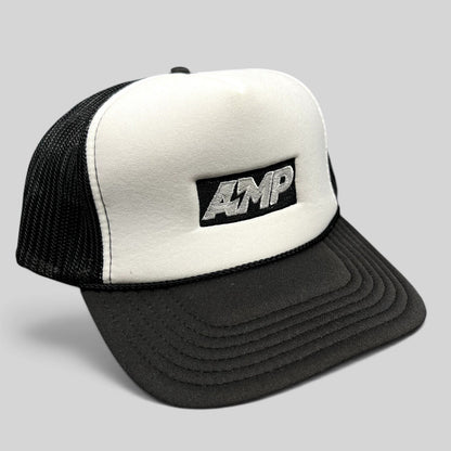 Raree Finds vintage AMP Any Means Possible trucker hat with a white foam front, black mesh back, and snapback closure.